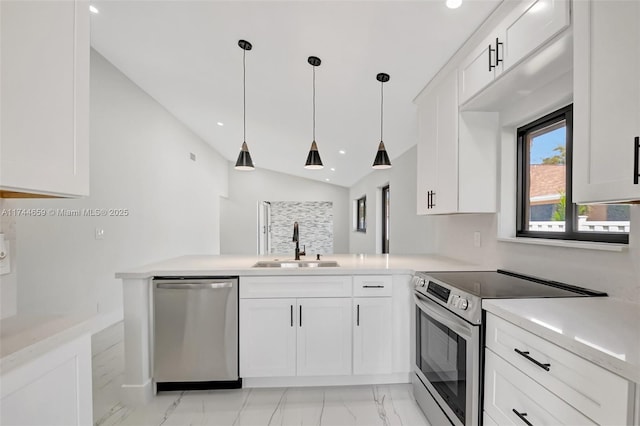 kitchen featuring white cabinetry, appliances with stainless steel finishes, light countertops, and a sink