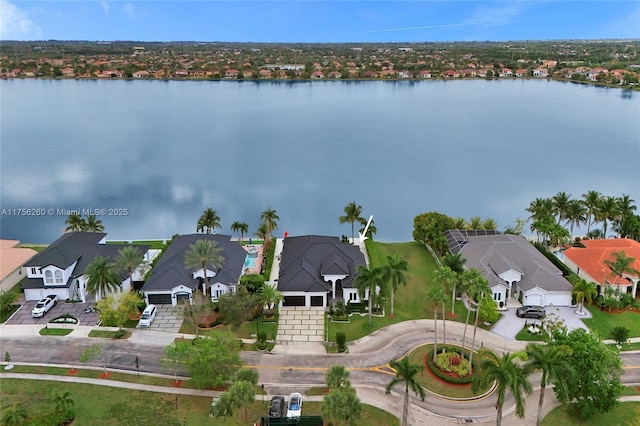 bird's eye view featuring a water view and a residential view