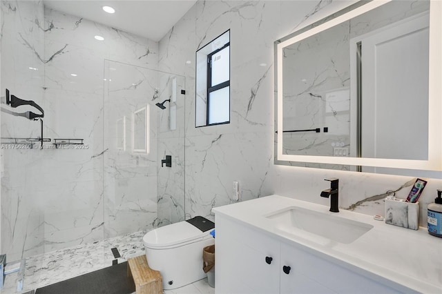 bathroom with a marble finish shower, vanity, toilet, and stone wall