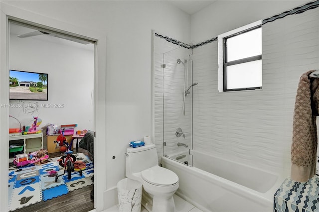 full bathroom with shower / bath combination and toilet