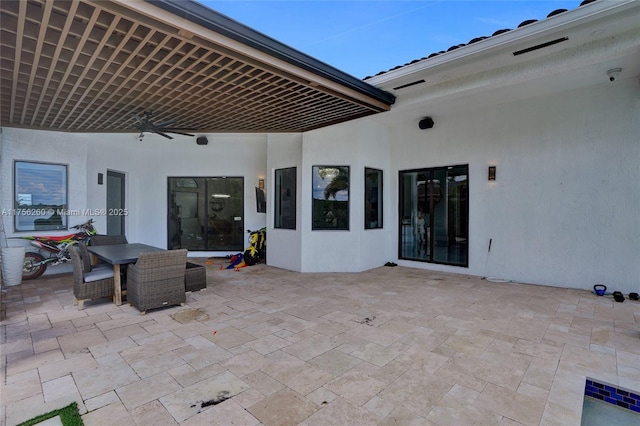 view of patio / terrace featuring outdoor dining area and ceiling fan