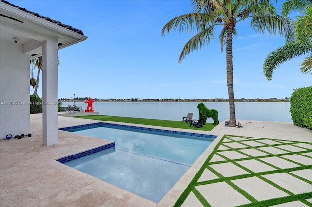 view of swimming pool with a fenced in pool, a yard, a patio area, and a water view