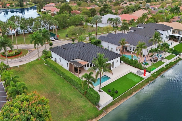 bird's eye view with a residential view and a water view