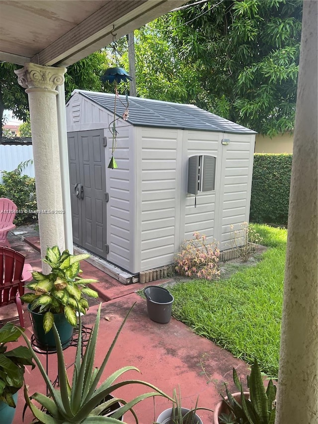 view of shed with fence