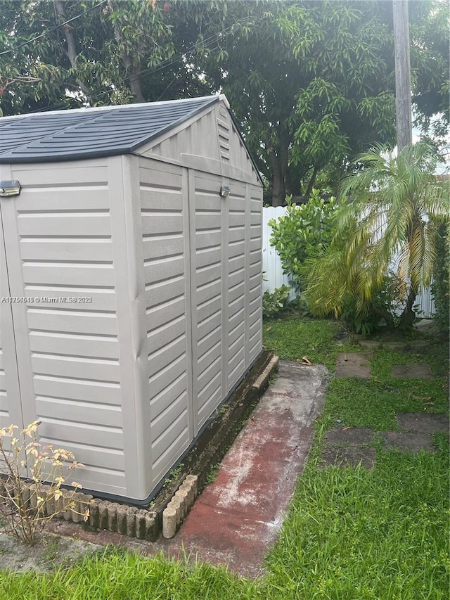 view of shed with fence