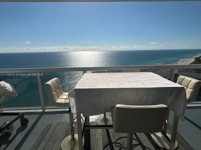 balcony featuring a water view