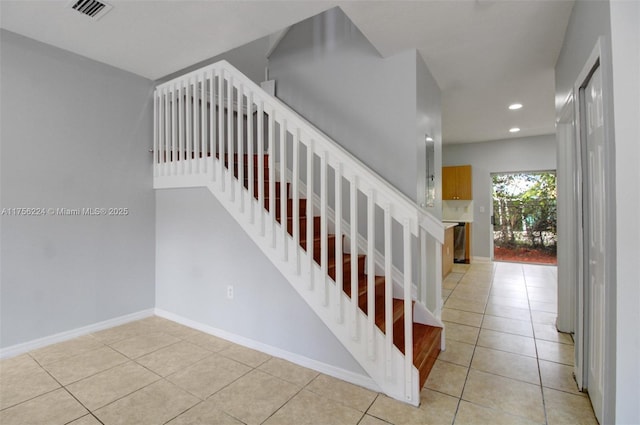 stairs with recessed lighting, baseboards, visible vents, and tile patterned floors