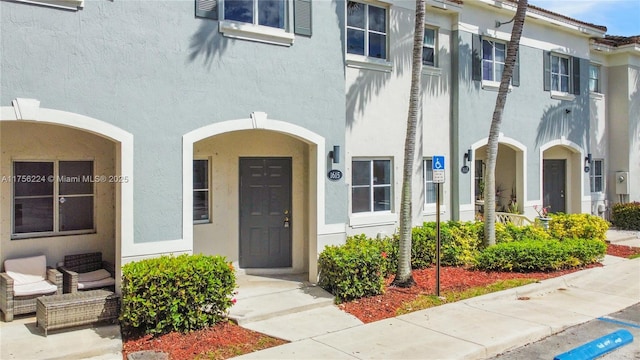 property entrance featuring stucco siding