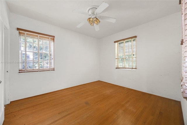 spare room featuring ceiling fan and wood finished floors