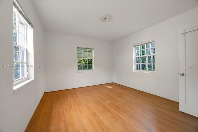 spare room featuring light wood finished floors