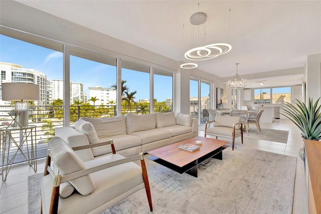 sunroom / solarium featuring a chandelier and a city view