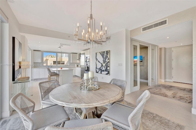 dining area with visible vents, recessed lighting, a chandelier, and light tile patterned floors