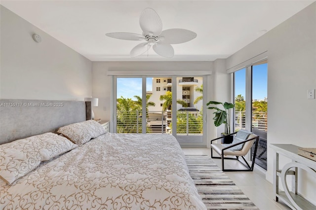 bedroom featuring light tile patterned floors, access to exterior, and multiple windows