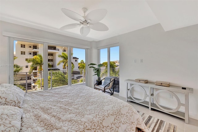 tiled bedroom with access to exterior and ceiling fan