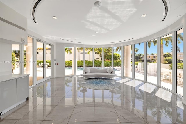 unfurnished sunroom featuring french doors