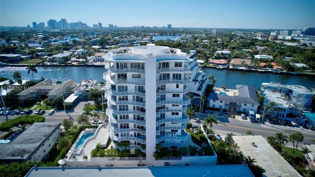 drone / aerial view featuring a water view and a view of city