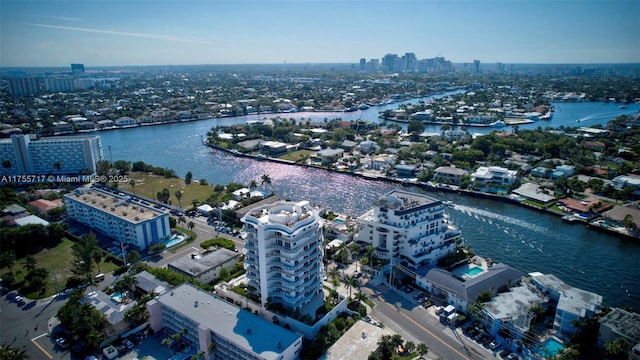 drone / aerial view with a city view and a water view