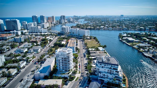 drone / aerial view featuring a water view and a city view