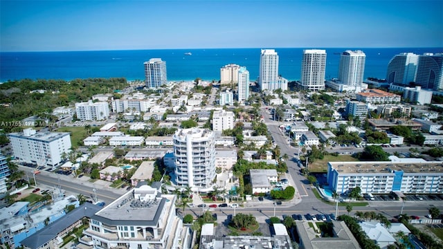 bird's eye view featuring a water view and a city view