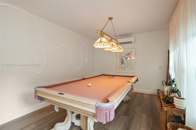 playroom featuring pool table, a wall unit AC, wood finished floors, and baseboards