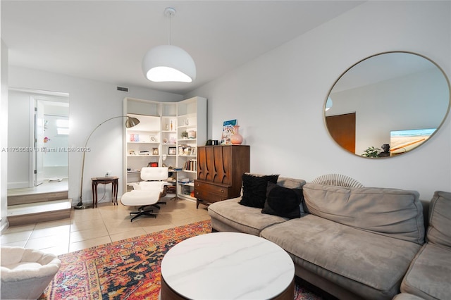 living area with light tile patterned flooring and visible vents