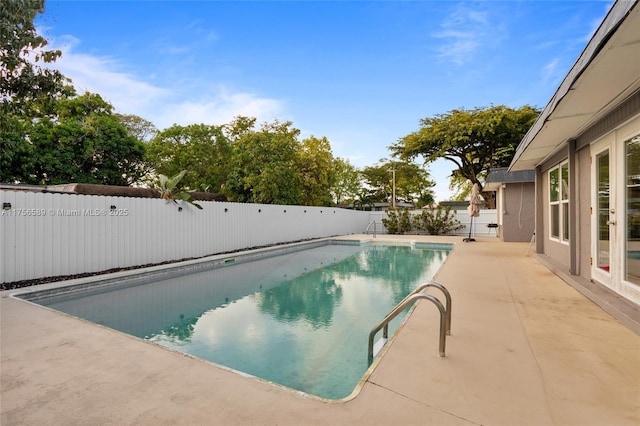 view of pool with a patio area, a fenced backyard, and a fenced in pool