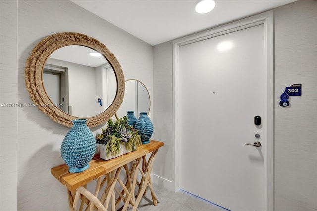 doorway to outside featuring tile patterned flooring