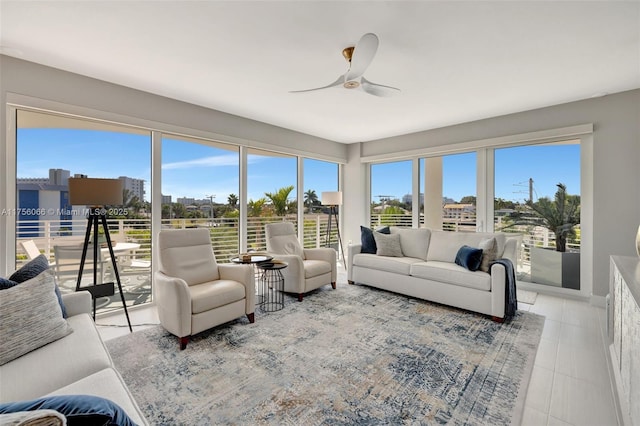 sunroom with a view of city and ceiling fan