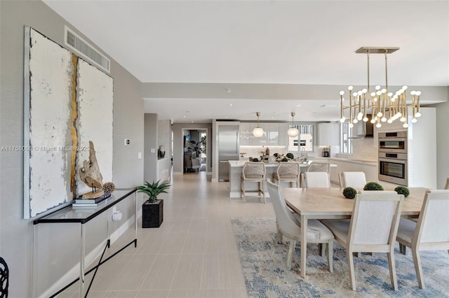 dining area featuring light tile patterned floors, visible vents, and recessed lighting