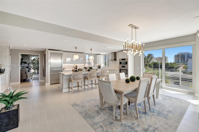 dining room featuring recessed lighting, a healthy amount of sunlight, and baseboards