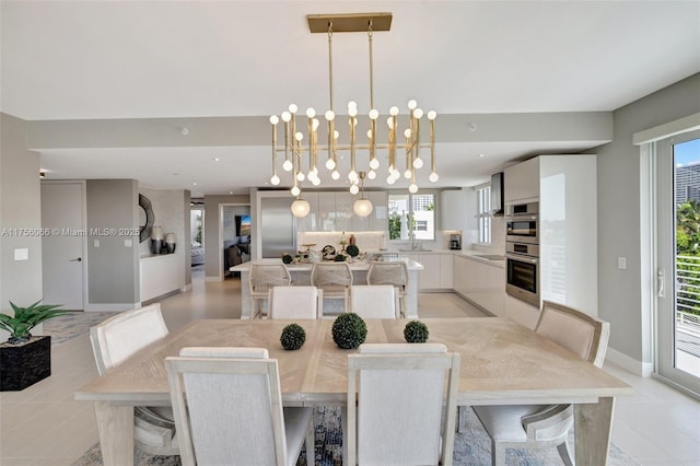 dining space featuring recessed lighting, baseboards, and a chandelier