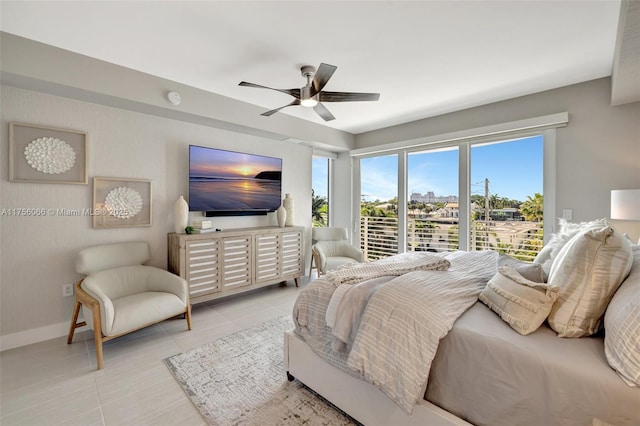 tiled bedroom with baseboards and a ceiling fan
