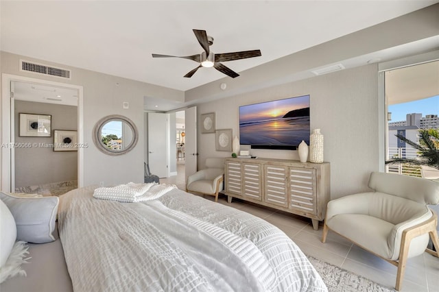 tiled bedroom featuring visible vents and ceiling fan