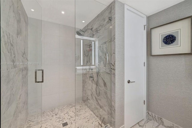 bathroom with recessed lighting, a marble finish shower, and marble finish floor