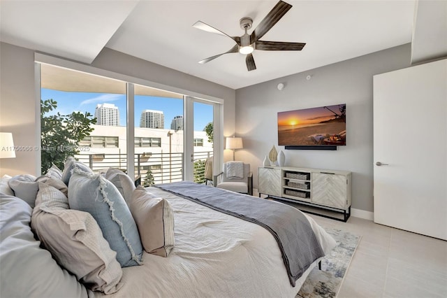 tiled bedroom with a ceiling fan, baseboards, and access to outside