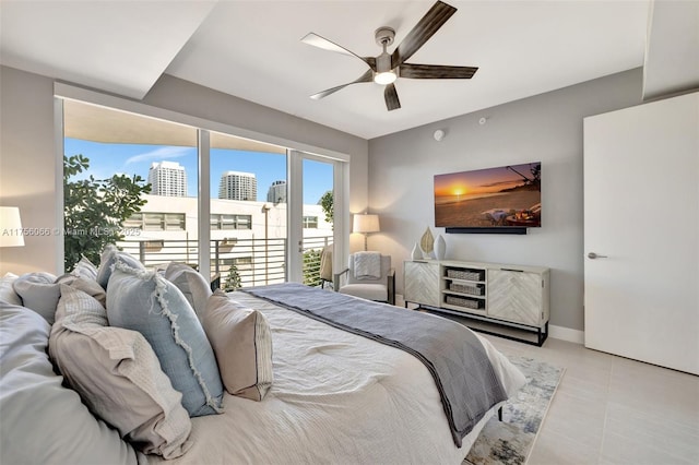 bedroom featuring access to exterior, baseboards, and a ceiling fan