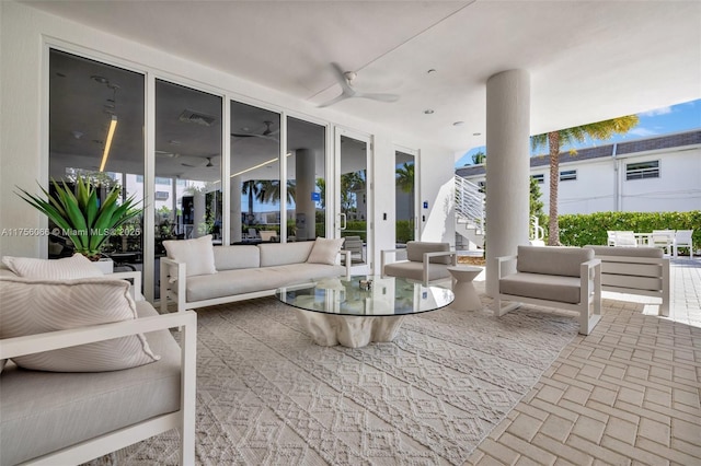 exterior space with an outdoor hangout area, a ceiling fan, and visible vents
