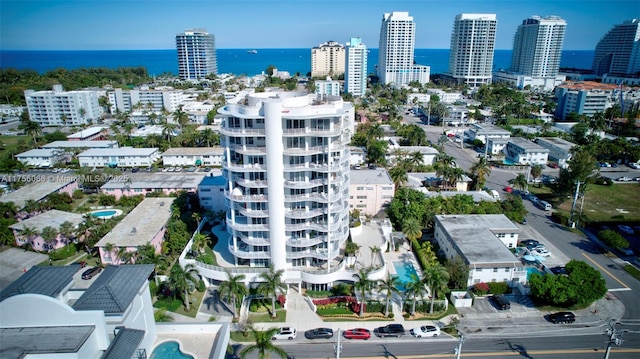 birds eye view of property with a city view and a water view