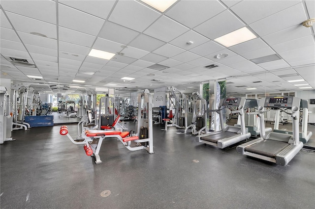 workout area featuring a paneled ceiling and visible vents