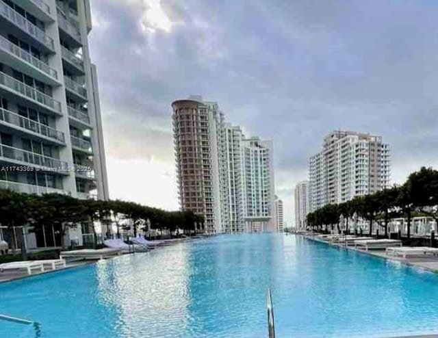 view of swimming pool featuring a view of city