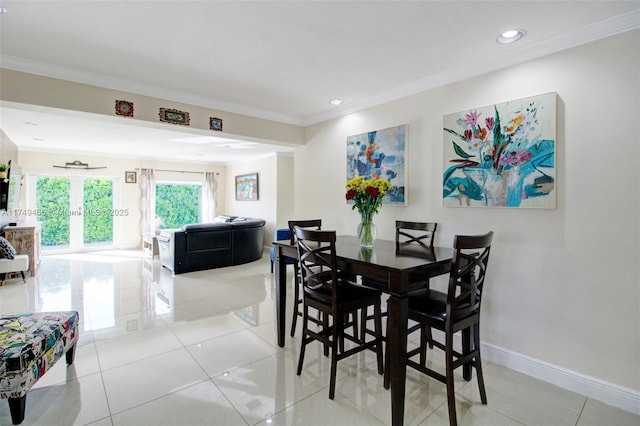 dining area with light tile patterned floors, ornamental molding, recessed lighting, and baseboards