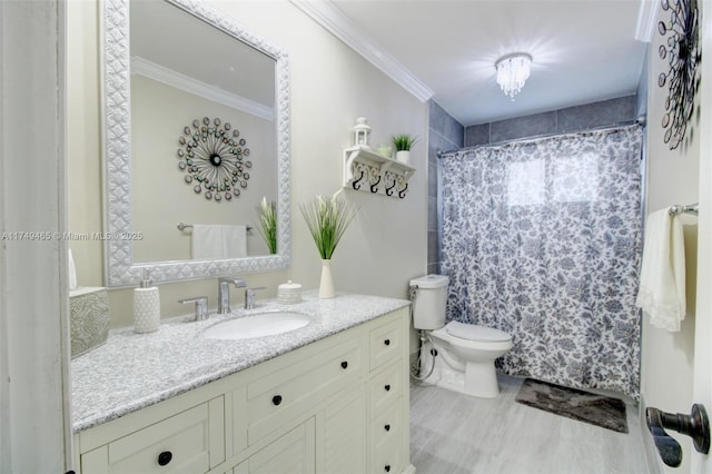 full bath featuring crown molding, vanity, toilet, and wood finished floors