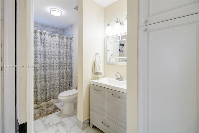 full bathroom featuring curtained shower, marble finish floor, vanity, and toilet