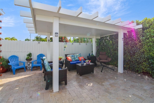 view of patio featuring an outdoor hangout area and fence