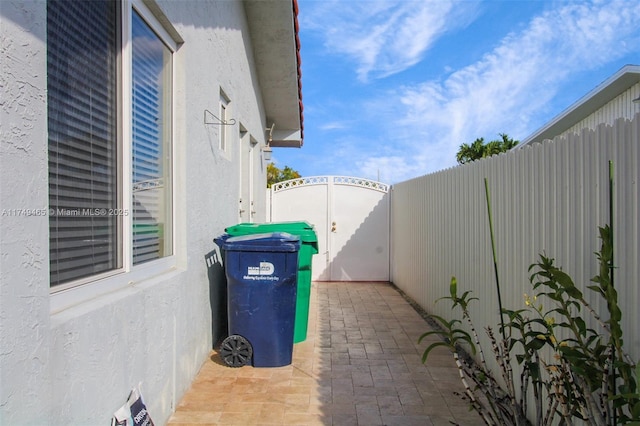 view of patio / terrace featuring a gate and fence