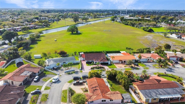 aerial view with a water view and a residential view