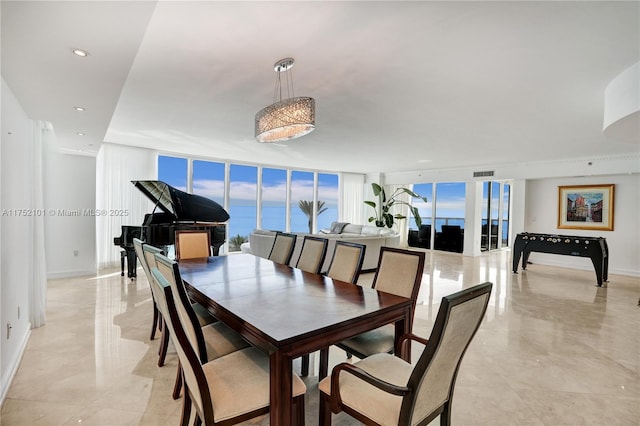 dining space featuring expansive windows, visible vents, baseboards, and recessed lighting