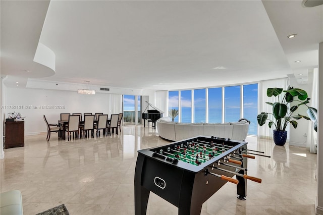 playroom featuring a wall of windows, recessed lighting, and visible vents