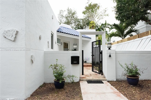 view of gate with fence