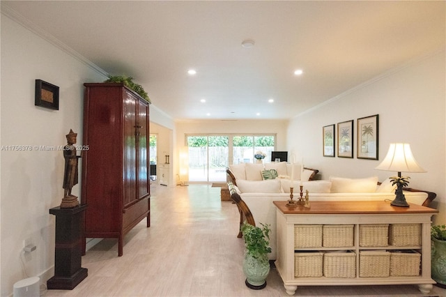 living room featuring light wood-style floors, ornamental molding, and recessed lighting